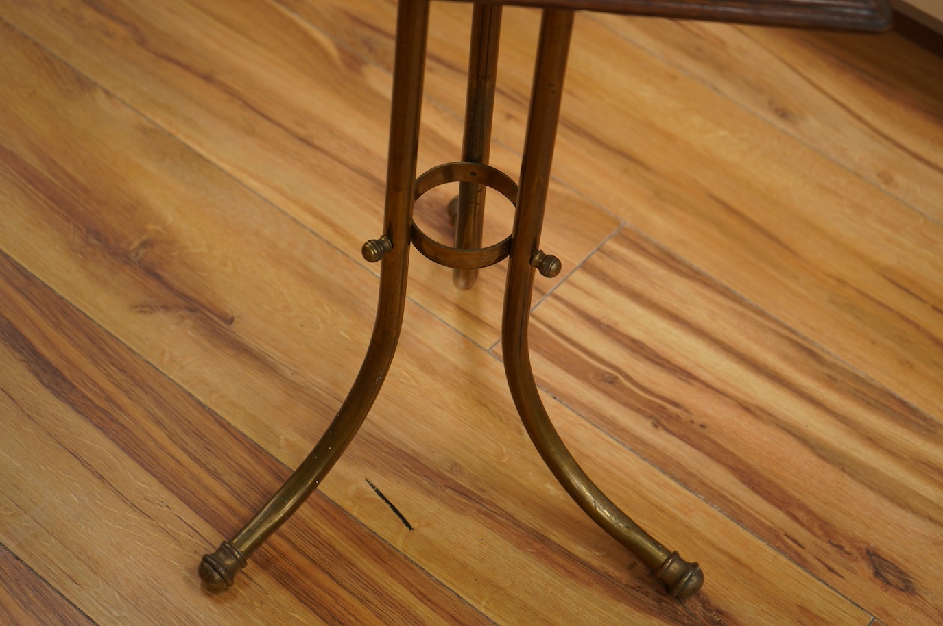 An Edwardian oak and brass Canterbury stand, 76cm. Condition - fair to good.